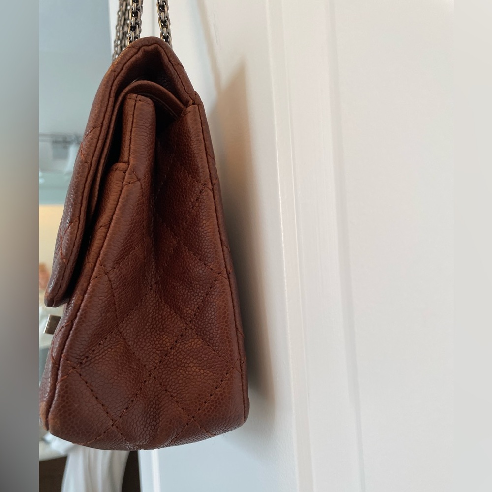Louis Vuitton 2.55 medium double flap in a vintage rust color.
